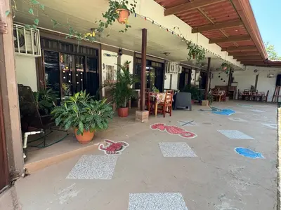 an outdoor patio with chalk drawings on the ground at Casa Grande Villas Ela en Bahía Ballena in Uvita