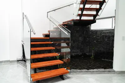 a staircase in a house with a bench at home 333 habitacion 332 in Escazu