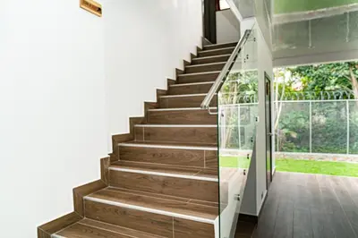 a staircase in a house with wooden floors at home 333 habitacion 332 in Escazu