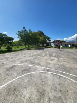 an empty basketball court with a person standing in it at BnB Ecostay in San José