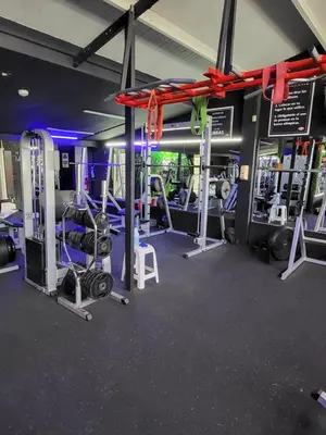 a gym with several treadmills and machines at BnB Ecostay in San José