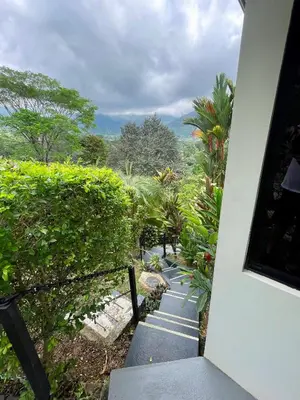 a stairway leading up to a house with a view at Villas Pura Vida in Ojochal