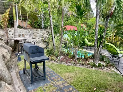 a grill sitting on the grass in a garden at Villas Pura Vida in Ojochal