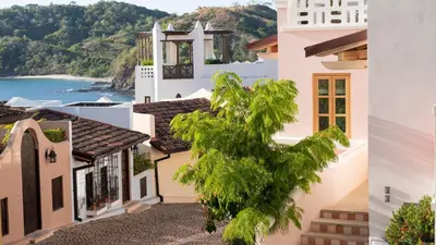 a view of the town of positano from a building at Las Catalinas Doorway in Playa Flamingo