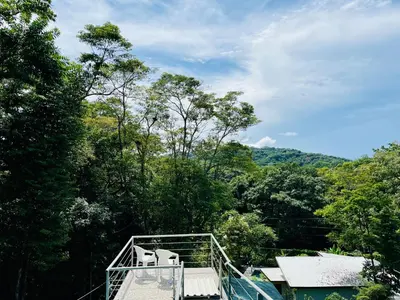 a view from the top of a house with trees at Olas de Oro in Nicoya