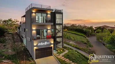 a rendering of a house with a sunset in the background at Casa Luna Amarillo - Your Pacific Escape! in Playa Hermosa