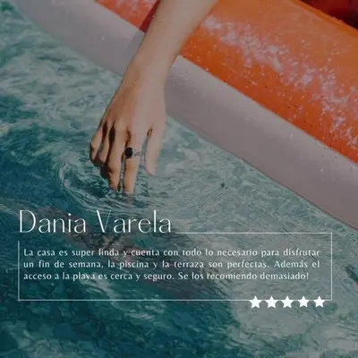 a picture of a person holding a surfboard in the water at Casa Las Palmas Playa Bejuco in Bejuco