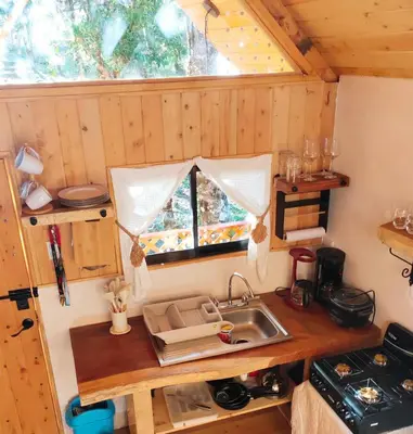 an overhead view of a kitchen in a tiny house at Cabaña Lugar de Paz in División