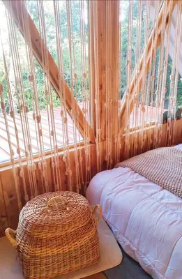 a room with a bed and a large window at Cabaña Lugar de Paz in División