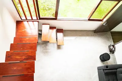 a staircase in a house with a window at home 333 loft 334 in Escazu