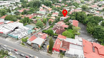 an aerial view of a city with a red marker at home 333 loft 334 in Escazu