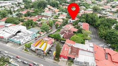 a red marker in the middle of a city at home 333 loft 334 in Escazu