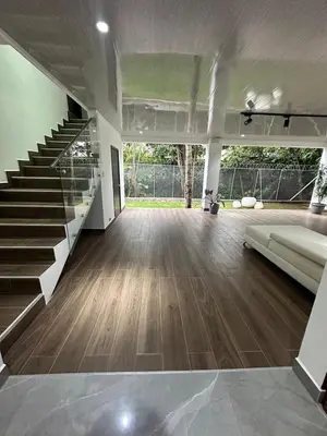 a living room with a staircase and a couch at home 333 habitacion 335 in Escazu