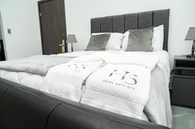 a bedroom with a bed with two towels on it at Home 333 habitacion 336 in Escazu