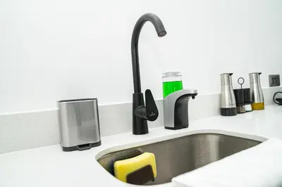 a kitchen sink with a black faucet at Home 333 habitacion 336 in Escazu