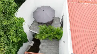 an overhead view of a patio with an umbrella at Home 333 habitacion 336 in Escazu