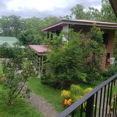 a house with a balcony with a garden at Apartamento Paseo de Damitas in Paquita