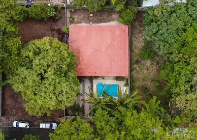 an overhead view of a house with a red roof at Beautiful 2-BR House Steps from the Beach in Playa Flamingo