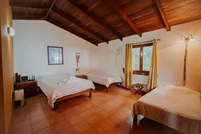 a bedroom with two beds and a window at Lodge Mirador - Great Swimming pool - Kitchen - BBQ - Netflix in Tajo Alto
