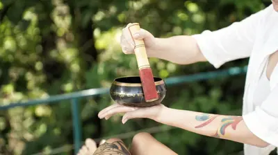 a person holding a black bowl with a cinnamon stick at Lodge Mirador - Great Swimming pool - Kitchen - BBQ - Netflix in Tajo Alto
