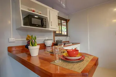 a kitchen with a table with a plate of food on it at Villa Palmera-Fortuna in Fortuna