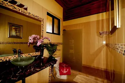 a bathroom with a sink and a mirror at The Lighthouse Ocotal in Coco