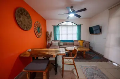 a living room with a table and a couch at Villa Cascada by Vacation Pura Vida in Esterillos