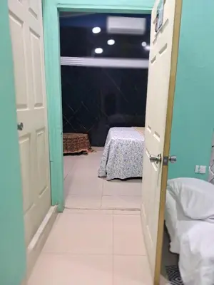 an open door to a room with a table at Brand New Descanso del Perezoso in Manuel Antonio