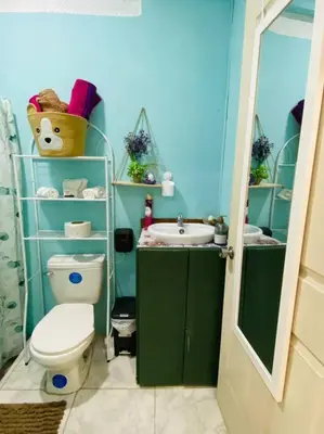 a bathroom with a toilet and a sink at Brand New Descanso del Perezoso in Manuel Antonio