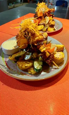 two plates of food sitting on a table at Hotel Linda Vista in Fortuna