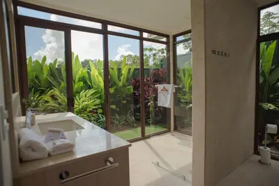 a bathroom with a sink and a large glass window at Fortuna Retreat in Fortuna