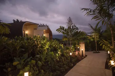 a walkway in front of a house with lights at Fortuna Retreat in Fortuna