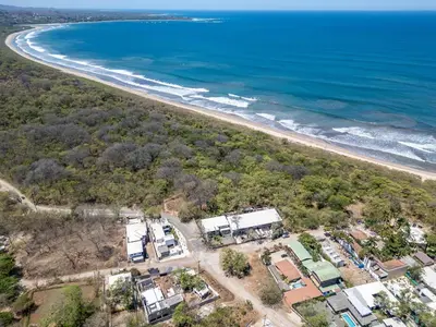 an aerial view of the beach and houses at BP Surf Hotel in Playa Grande
