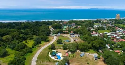 an aerial view of a town with the ocean at Ciudad del Mar 126 condo in Jacó