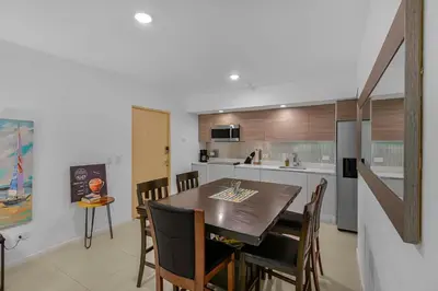 a kitchen and dining room with a table and chairs at Arcadia Condo In Místico, Playa Hermosa in Playa Hermosa