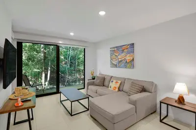 a living room with a couch and a table at Arcadia Condo In Místico, Playa Hermosa in Playa Hermosa