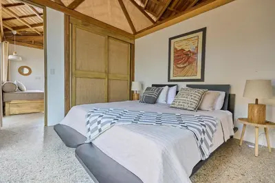a bedroom with a large bed in a room at SURÁ Playa Negra in Playa Negra