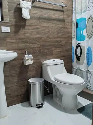 a bathroom with a toilet and a sink at Bernis House with Jacuzzi in Tanque