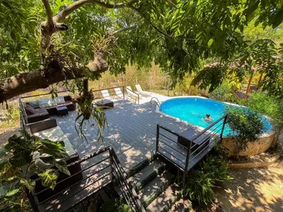 a pool with a person swimming in it at Donde Chalo in Paquera