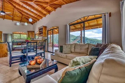 a living room with a couch and a table at The Retreat at Blue Mountain Farms in Sámara
