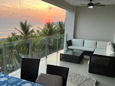 a living room with a view of the ocean at Diamante del Sol- 2 BR- Beach Front- Jaco in Jacó