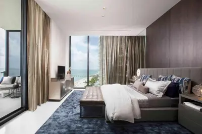 a bedroom with a bed and a view of the ocean at Diamante del Sol- 2 BR- Beach Front- Jaco in Jacó