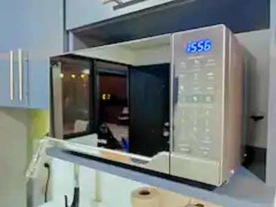 a microwave oven on a counter in a room at Casa Plomo - 10 bed, 5 bdrm - One Block from Clubs in Jacó