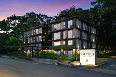 a building with a sign in front of it at Luxury 2BR condo in Nautilus, Místico in Parrita