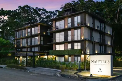 a large building with a sign in front of it at Luxury 2BR condo in Nautilus, Místico in Parrita