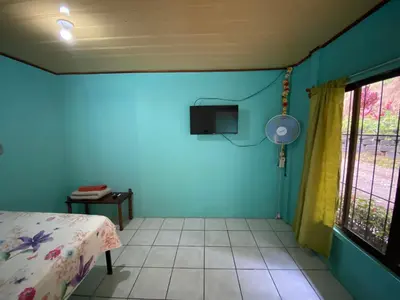 a room with a bed and a tv on the wall at viajero solitario in Buenos Aires