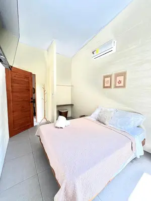 a bedroom with a large bed in a room at Casa Jalapa with private pool in Uvita