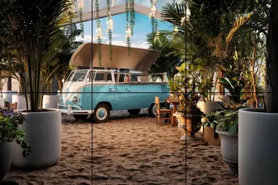 a blue and white van parked in a room with plants at Studio Sabana Secrt 3011 in San José