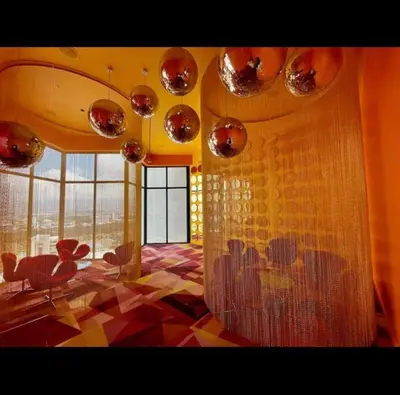 a living room with a large window and a room with a floor at Studio Sabana Secrt 3011 in San José
