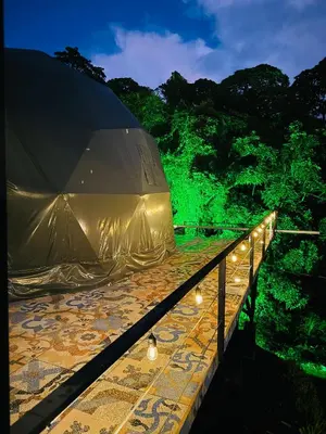 a tent on top of a bridge with lights at Cabañas de Montaña Magia del Poás in Poás